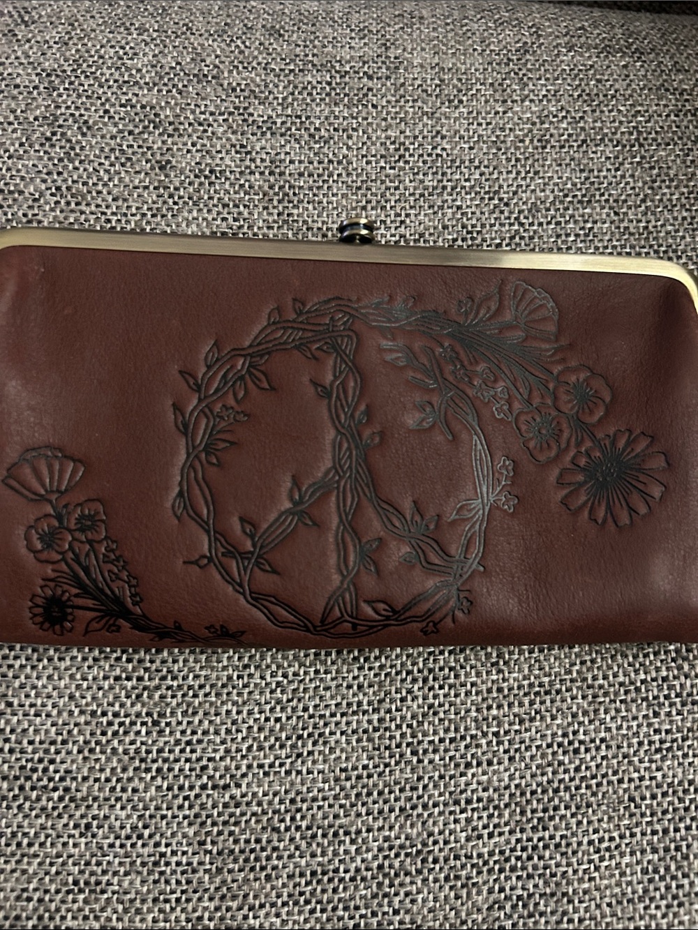 HOBO Lauren Clutch-Wallet Brown with embossed Peace Design on front